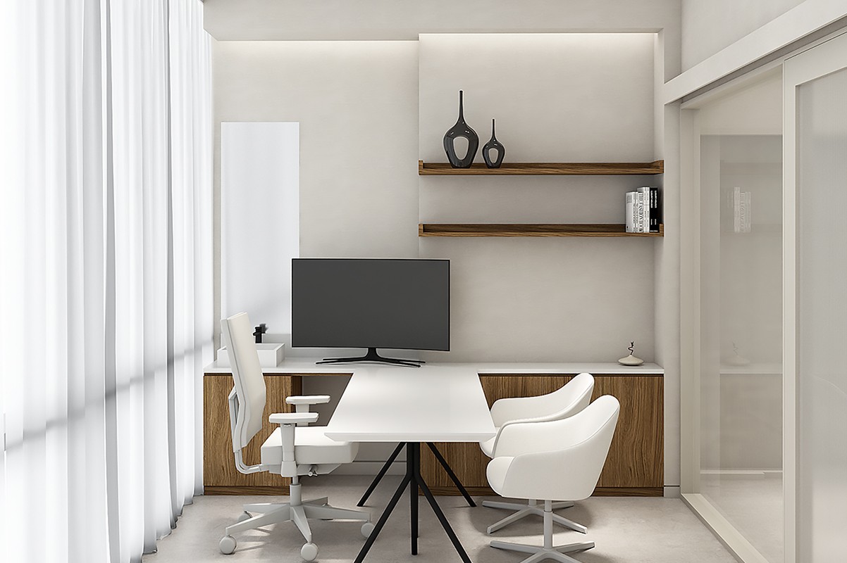 An interior image of a white wall with two rows of dark wood shelves, a white desk with a monitor, a white rolling office chair, and two round white chairs.